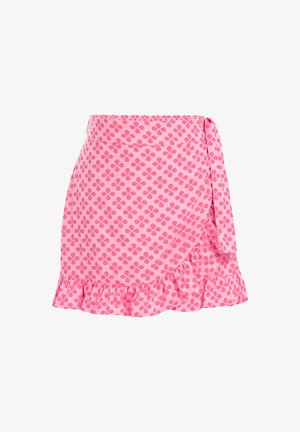 Jupe portefeuille rose avec un motif floral à quatre pétales rose foncé, lien sur le côté et ourlet à volants.