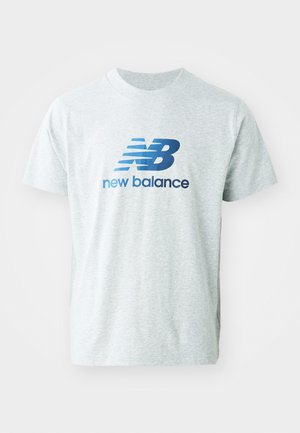 Gray short-sleeve T-shirt made of cotton blend with a blue "nb" logo and "new balance" text, featuring a crew neck design and smooth texture.