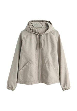 Hele beež värvliga kapuutsiga jakk, millel on ees taskud ja elastsed mansetid, valmistatud pehmest, vabaaja kangast.