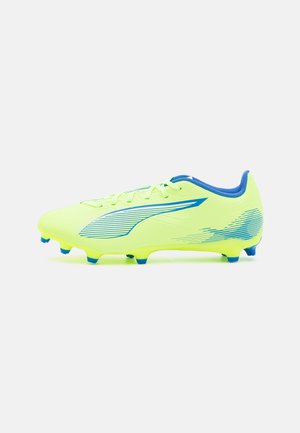 Crampons de football jaune vif avec des accents bleus, design élégant, surface texturée et crampons coniques sur la semelle extérieure pour une meilleure adhérence.