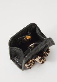 Black leather wallet with a textured finish, featuring a gold snap closure and a leopard print interior lining. Compact design with two compartments.