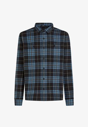 Chemise flanelle noire et bleue avec un motif à carreaux, manches longues, devant à boutons et deux poches poitrine. Fabriquée en tissu doux.