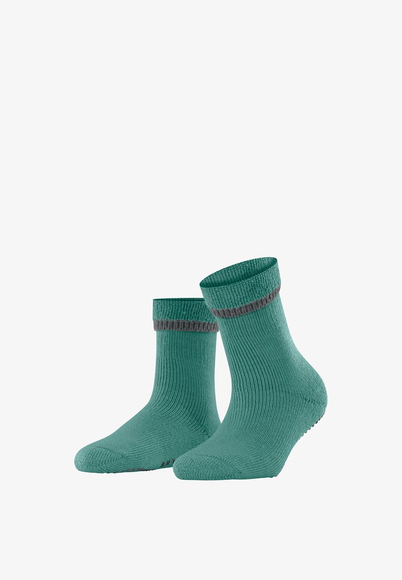 Calze verdi lavorate a maglia con una texture a coste, con un gambale grigio a contrasto. Il design è alla caviglia e presenta dettagli antiscivolo sulla suola.