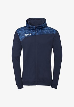 Sweat à capuche zippé bleu marine avec un yoke à motif géométrique en nuances de bleu et le logo "Kempa" sur le côté gauche de la poitrine.