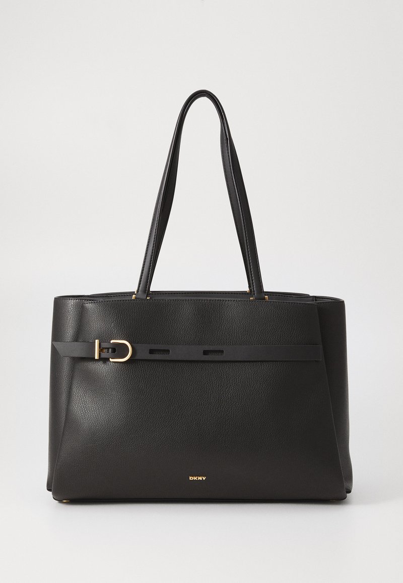 Black leather tote bag with two top handles, featuring a gold buckle accent and a textured finish. Logo embossed at the bottom.