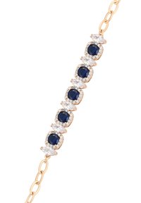 Bracciale d'oro con zaffiri blu rotondi alternati a diamanti trasparenti a taglio marquise disposti in una fila verticale.