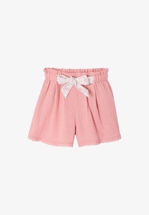 Pink textured fabric shorts with elastic ruffled waistband and a tied white floral belt bow at the front center.