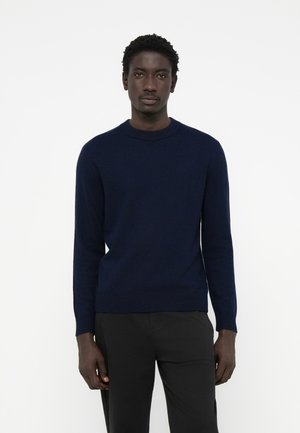 Navy blue knit sweater with a round neckline, long sleeves, and ribbed cuffs and hem. Soft texture with a minimalistic design.