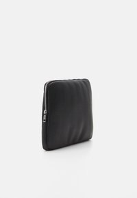 Black padded laptop sleeve made of smooth leather with a silver zipper closure, featuring a rectangular shape and minimalistic design.