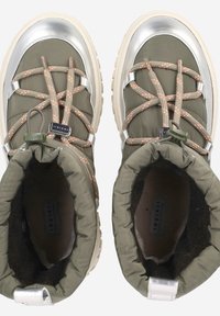 Olive green insulated boots with silver toe caps, elastic laces, and visible stitching. Soft cuffed tops with a fur lining and textured soles.