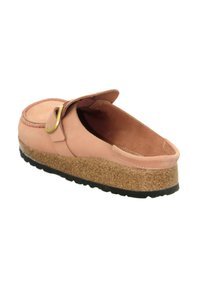 Pink suede slip-on shoe with a cork sole, featuring a round toe, padded footbed, and a single strap with a gold buckle accent.