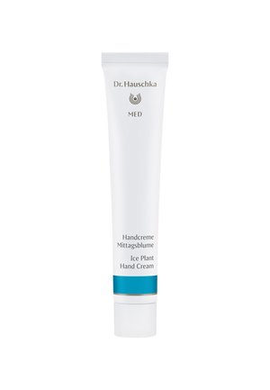 White squeeze tube with a twist cap. Silver detailing, blue accent band. Text includes "Dr. Hauschka," "MED," and "Ice Plant Hand Cream."