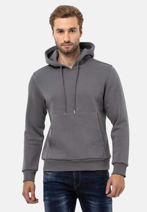 Grauer Hoodie aus weichem Material, mit einer Brusttasche, verstellbarem Kordelzug an der Kapuze und gerippten Bündchen mit subtiler Logo-Akzentuierung.