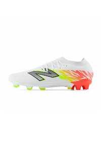 White soccer cleat with neon green and red studs, black and neon yellow zigzag pattern, and large black "N" logo on side.