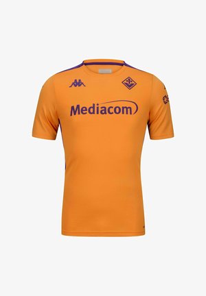 Maillot à manches courtes orange avec des accents et des logos violets. Fabriqué en tissu respirant, il présente un col rond et une finition texturée.