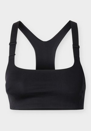 Brassière de sport noire avec larges bretelles réglables et dos nageur, posée à plat sur un fond blanc.