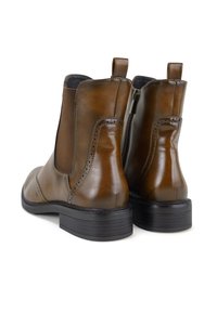 Braune Leder-Ankle-Boots mit elastischen Seitenpanelen, glatter Oberfläche, dekorativem Durchbruchdesign und niedrigem schwarzen Gummihacken.