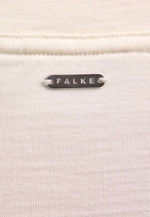 Cremefarbenes Stoff mit feiner Rippstruktur; verfügt über ein silbernes Etikett mit der Aufschrift "FALKE", das mit einem weißen Faden befestigt ist.