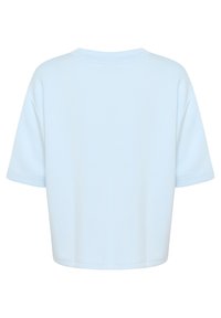 Heledad sinine lühikeste varrukatega lühike särk, ümar kaelus ja pehme kangas. Tagaküljel on lihtne disain, ilma nähtavate logode või mustriteta.