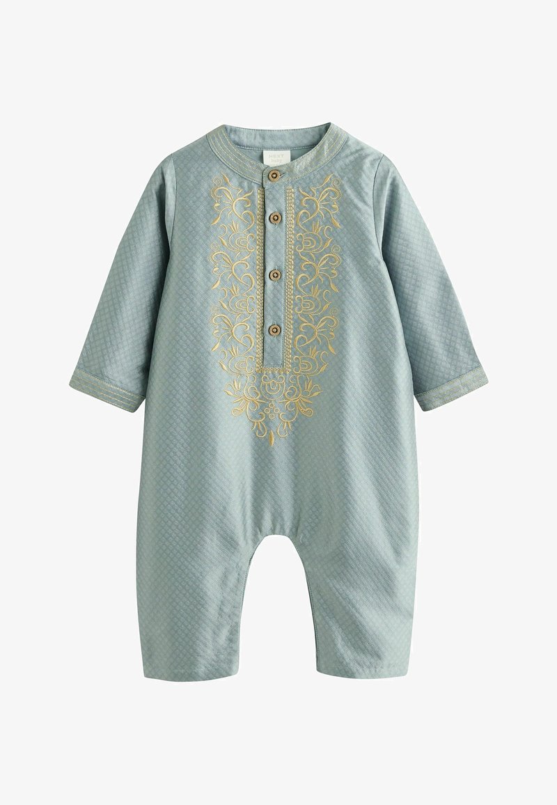 Grenouillère en coton bleu clair à manches longues, ornée d'un motif brodé doré, fermeture à boutons, et motif texturé en losanges.