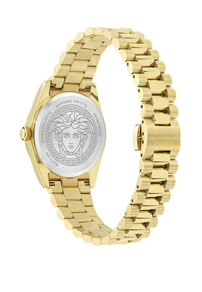 Zelta nerūsējošā tērauda pulkstenis ar apaļu korpusu, savienotu siksniņu un Medūzas dizainu uz teksturētā aizmugures. Iespējas: safīra kristāls. Ūdensizturīgs līdz 3 ATM.