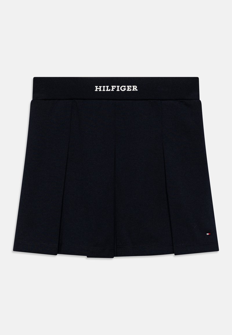 Gonna nera plissettata in cotone con un elastico in vita, con la scritta "HILFIGER" in bianco. Piccolo logo accento vicino all'orlo.