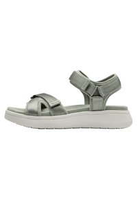 Gray sandal with cross-strap design, textured fabric, adjustable straps, and a thick white rubber sole. Features a cushioned footbed.