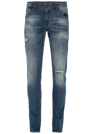 Vervaagde blauwe jeans met een slim fit, voorzien van versleten details en scheuren aan de voorkant, vijf-pocket ontwerp en metalen knoophardware.