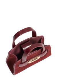 Burgundy handbag made of leather and suede, featuring two handles, a compact design, and a gold-tone clasp on the front.