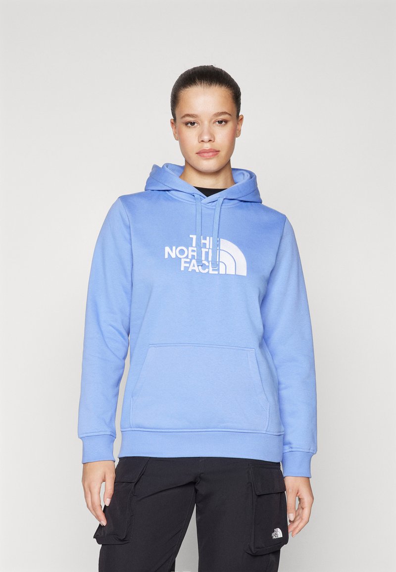 Felpa azzurra con tasca anteriore, caratterizzata da un grande logo bianco. Ha un cappuccio e polsini a coste per una vestibilità aderente.
