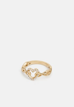 Gold-tone metal ring featuring a heart design with intertwined elements and clear gemstone accents along the heart's edge.