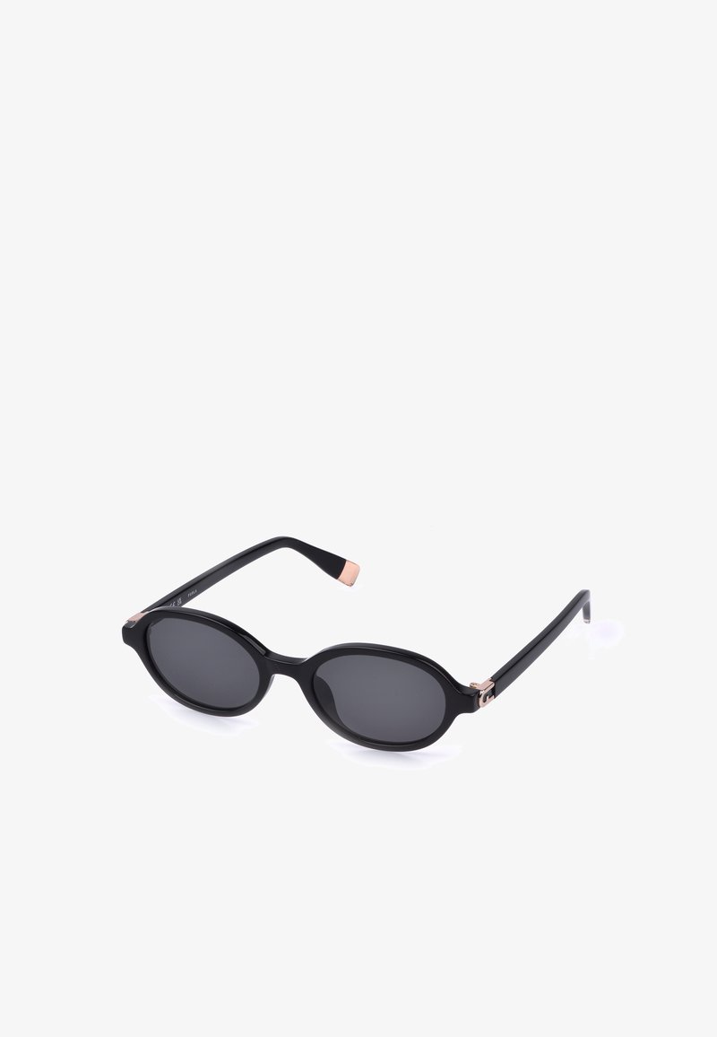 Lunettes de soleil ovales noires avec verres foncés et branches fines, avec de petits accents en or rose aux charnières et aux extrémités des branches.