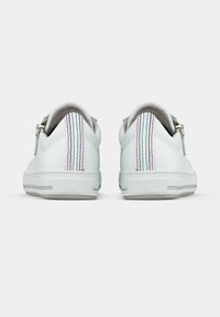 White leather sneakers with a smooth finish, featuring a back design with red, blue, and gray stripes, and a rubber sole.