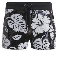Shorts à sequins noirs et blancs avec un motif floral, dotés d'une ceinture élastique et d'un cordon de serrage pour un ajustement réglable.