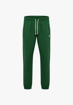 Pantalons de jogging en polaire verte avec une taille élastique, un cordon de serrage ajustable et des jambes fuselées. Présente un petit logo sur le côté gauche.