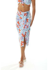 Knee-length wrap skirt in light blue fabric with floral pattern in orange, purple, and green tones; features a side slit and knotted detail.