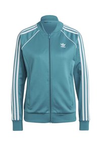 Tyrkysová sportovní bunda na zip, s bílými třípruhovými akcenty na rukávech, s logem adidas na hrudi a s žebrovanými manžetami.