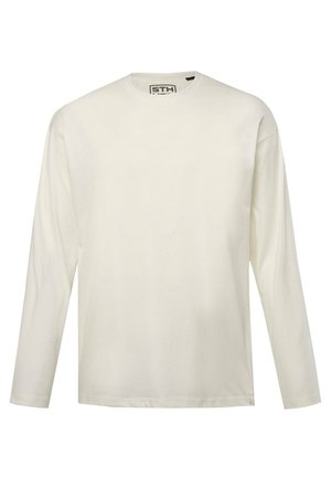 T-shirt z długim rękawem i okrągłym dekoltem w jasnym kremowym kolorze. Wykonany z miękkiej bawełny, o standardowym kroju z minimalnymi detalami.
