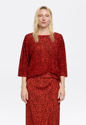 Trui - animalspots rojo