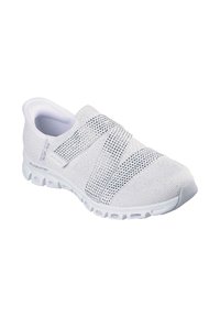 Zapatilla blanca sin cordones con parte superior de malla, correas elásticas cruzadas y acentos texturizados. Suela de goma gruesa con amortiguación visible y ventilación.