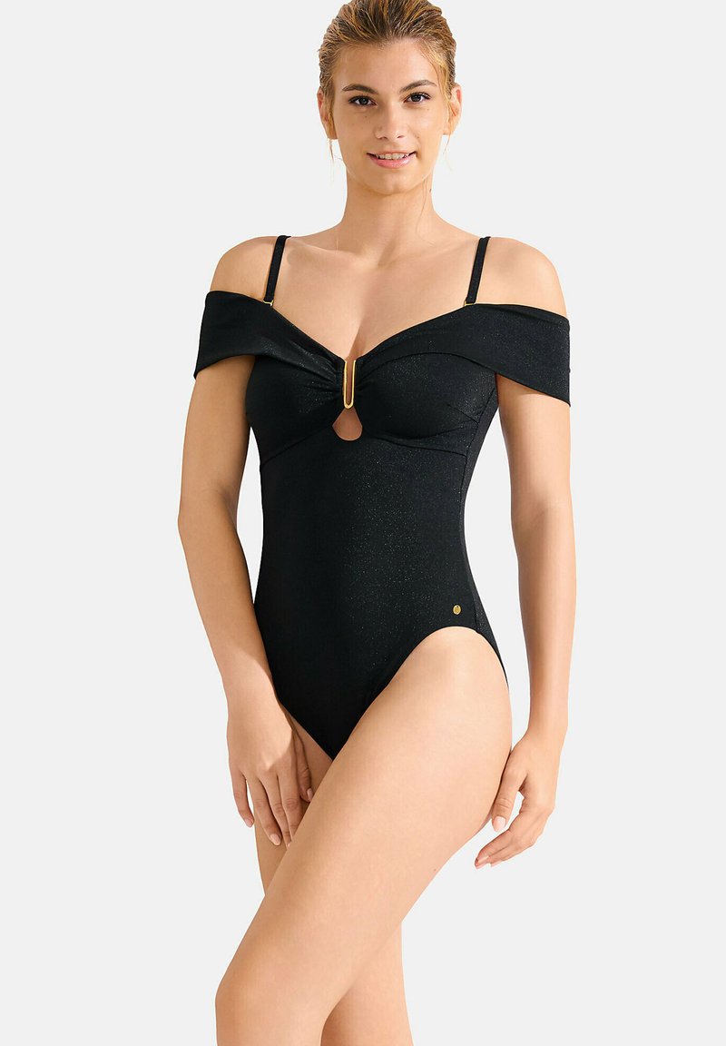 Maillot de bain noir une pièce avec design dénudé d'une épaule, découpe en forme de trou de serrure et détails en métal doré. Fabriqué en matériau texturé avec une touche de brillance.