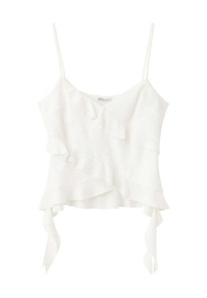 Hvid ærmeløs flæset camisole top med tynde stropper og asymmetrisk lagdelt kant med to hængende stofbånd.