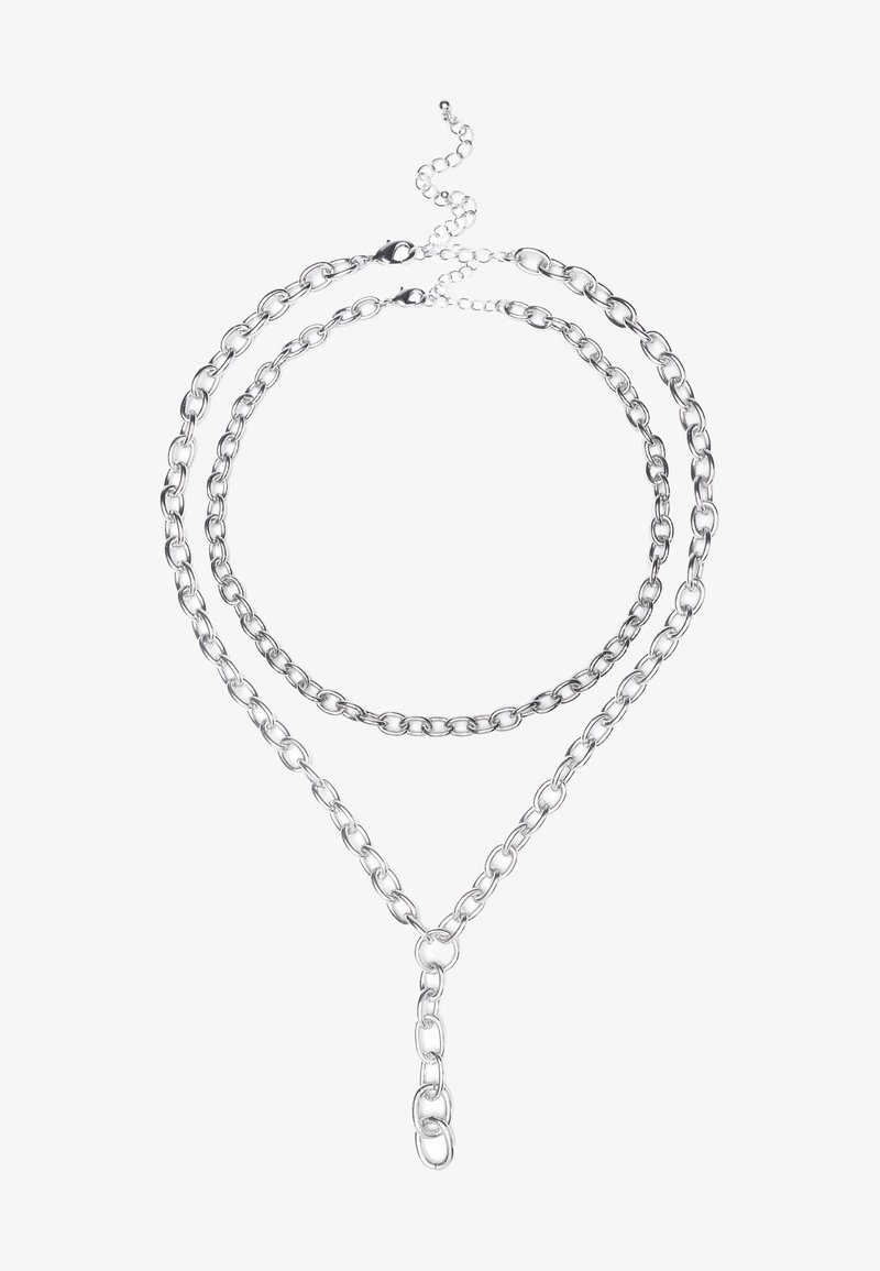 Collier en acier argenté avec deux brins superposés en maillons ovales et un design en forme de Y. Texture lisse et fermeture à crochet.