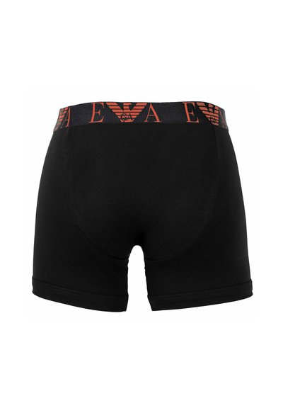 Zwarte katoenen boxershorts met een merkband en een rood-zwart geometrisch ontwerp. Soepele textuur en aansluitende pasvorm.
