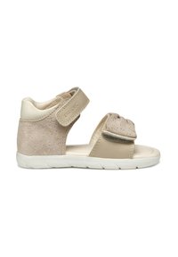 Sandal in tonal beige con una toma in suede strutturato, fascia regolabile in Velcro e suola in gomma bianca con un design del battistrada flessibile.