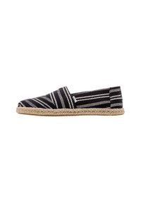 Black and white striped espadrille with a woven textile upper, closed toe, jute midsole, and flat rubber sole.