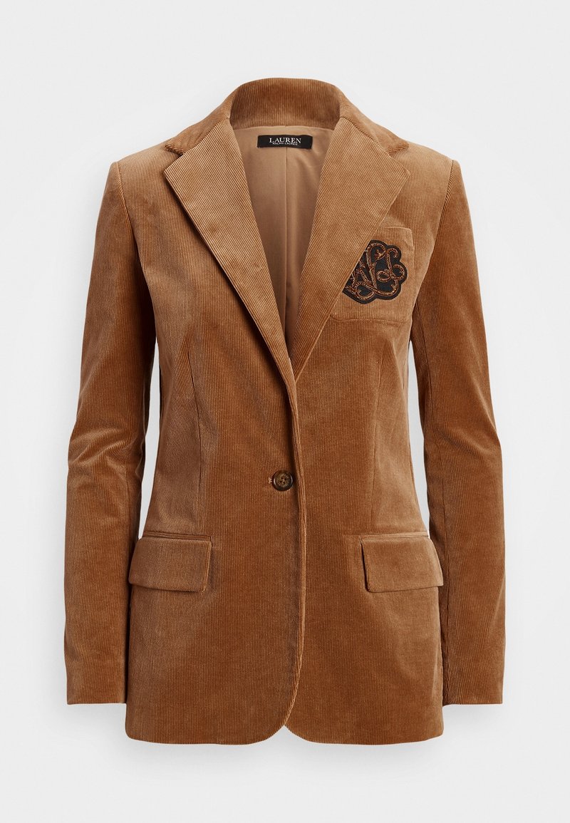 Blazer en velours côtelé marron à bouton unique, avec revers et monogramme noir brodé sur la poche poitrine gauche.