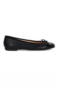 Black leather ballet flats with a rounded patent toe, decorative bow, and small gold accent. The sole is flat and flexible.