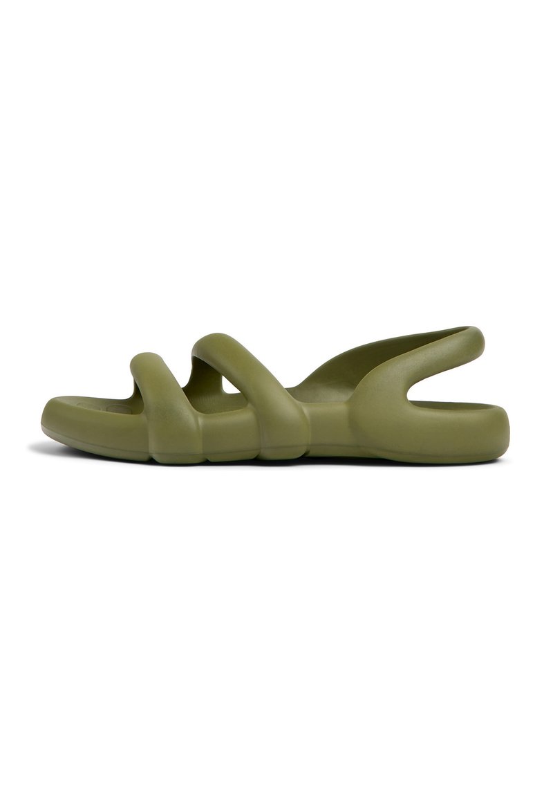 Green rubber slide sandal featuring curved straps, a chunky sole, and open back for breathability. Smooth texture with a minimalist design.