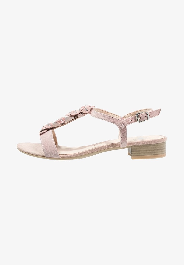 Sandale en daim rose avec petit talon bloc, bride de cheville à boucle et ornements floraux décoratifs sur la bride en T.